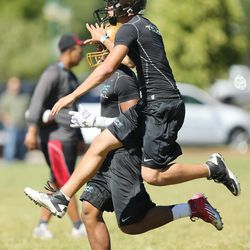 Players have some fun working out during All Poly Camp in Layton Thursday, June 20, 2013.