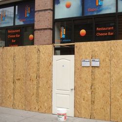 Plywood outside the former Bistro Lamazou, reportedly becoming a sports bar. [Photo: <a href="http://www.pcvstbee.com/2013/07/sports-bar-opening-where-bistro-lamazou.html">pcvstBee</a>]