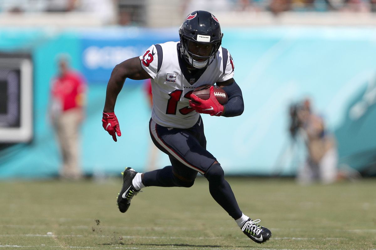 Brandin Cooks #13 of the Houston Texans runs for yardage during the first half of the game against the Jacksonville Jaguars at TIAA Bank Field on October 09, 2022 in Jacksonville, Florida.