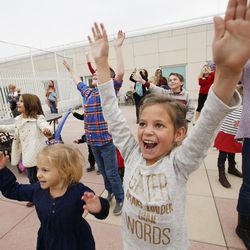 Maisy Smith, a former patient at Primary Children's Hospital and other children of Festival of Trees leadership wave to Santa as he arrives at the Salt Lake hospital via KSL-TV's Chopper 5 on Wednesday, Nov. 16, 2016. Santa spent time with the children playing bingo and bringing them a present.