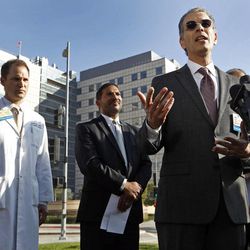 Dr. David Feinberg, president, UCLA Health System, right, takes questions from the media outside the Ronald Reagan UCLA Medical Center in Los Angeles Thursday, Feb. 19, 2015. Health officials at the news conference sought to reassure the public that a "superbug" bacterial outbreak at the local hospital doesn't pose any threat to public health. A day earlier, UCLA officials said nearly 180 patients at Ronald Reagan UCLA Medical Center had been exposed to antibiotic-resistant bacteria called CRE.  At left, is Dr. Zachary Rubin, medical director of clinical epidemiology and infection prevention and at center is Dr. Robert Cherry, chief medical and quality officer, UCLA Health System.