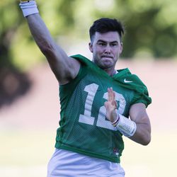 Tanner Mangum passes the ball during the Cougars' first practice of the season in Provo on Thursday, July 27, 2017.