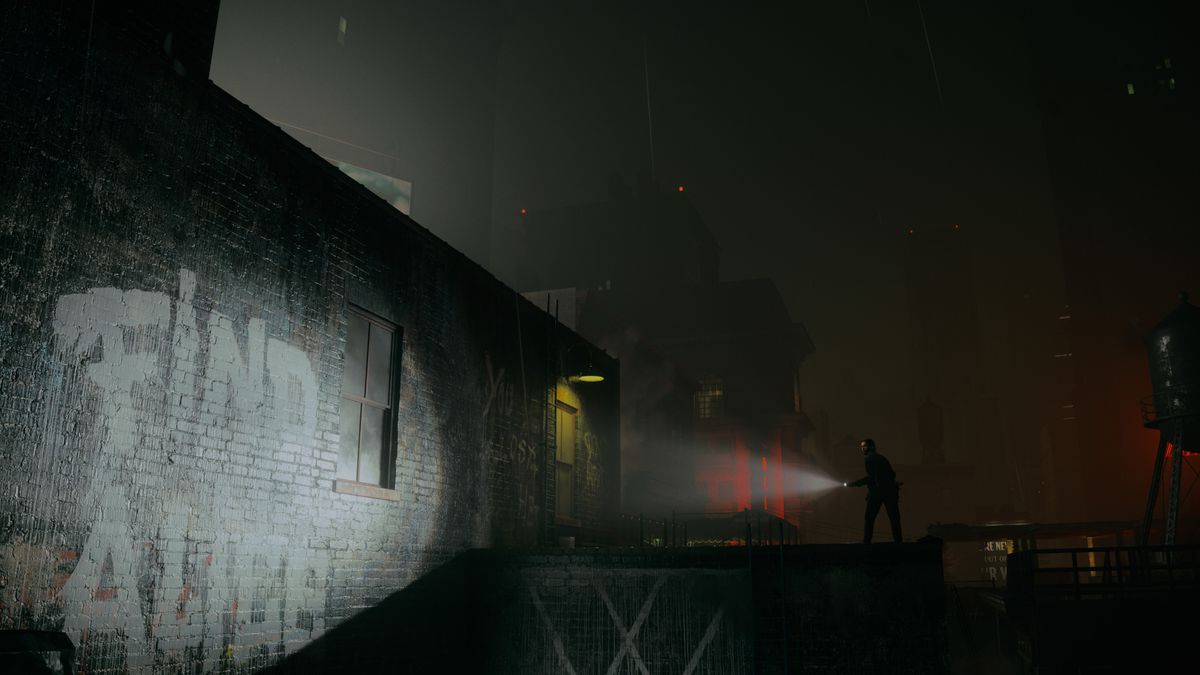 Alan Wake standing on the rooftop of a building, shining a flashlight beam at graffiti on a gray brick wall that reads “Find Alice” in Alan Wake 2.