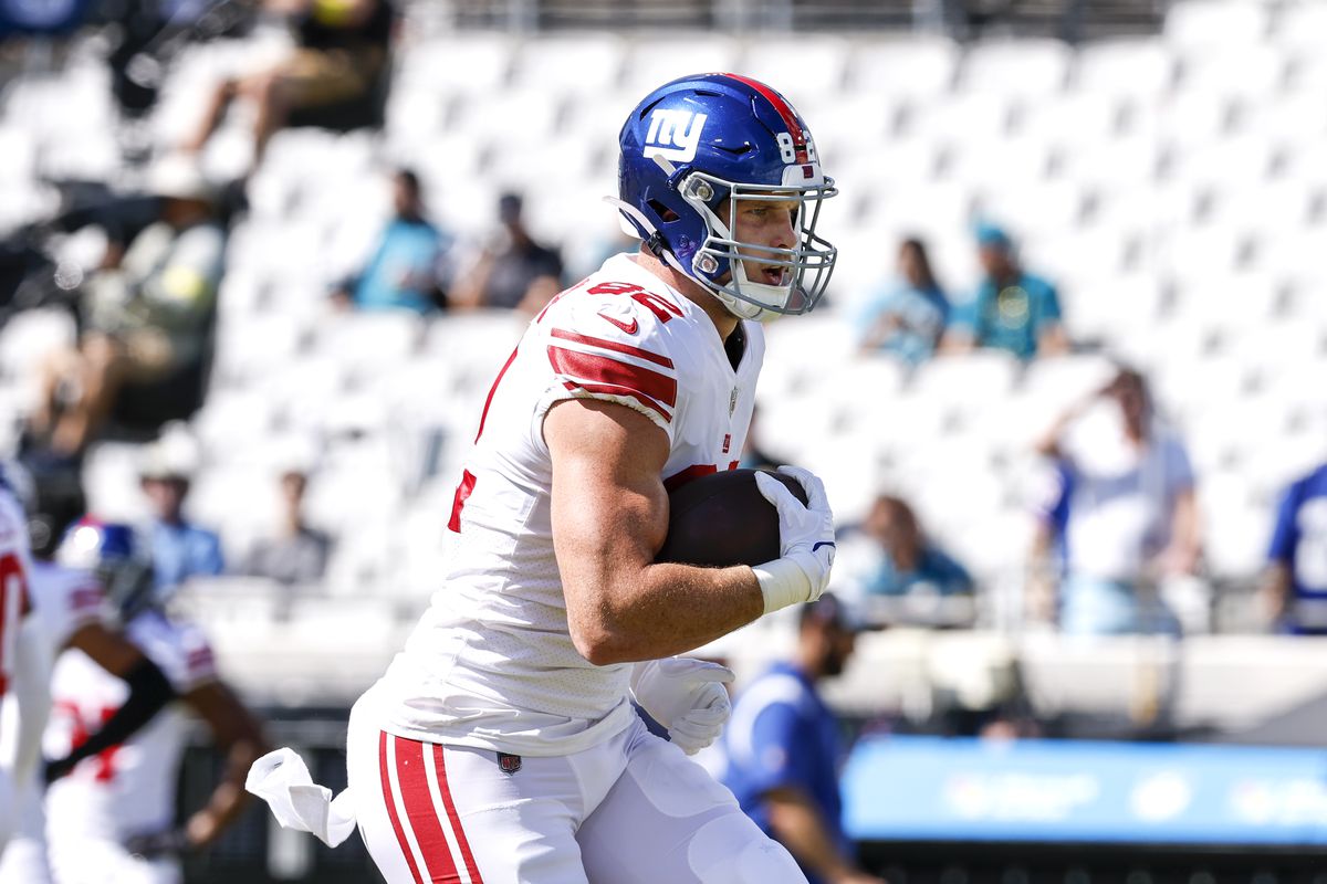 Tight End Daniel Bellinger #82 of the New York Giants during pregame warm-ups before the game against the Jacksonville Jaguars at TIAA Bank Field on October 23, 2022 in Jacksonville, Florida. The Giants defeated the Jaguars 23 to 17.