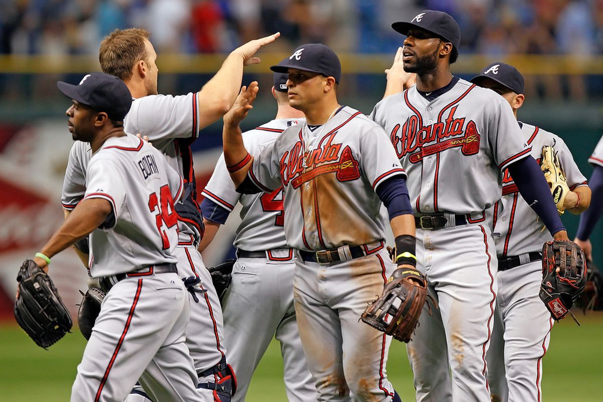 ST. PETERSBURG - MAY 20:  The Atlanta Braves celebrate their victory over the Tampa Bay Rays at Tropicana Field on May 20, 2012 in St. Petersburg, Florida.  (Photo by J. Meric/Getty Images)