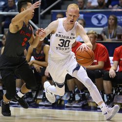 Brigham Young Cougars guard TJ Haws (30) drives around Brigham Young - Hawaii point guard Bailey Kikuchi (0) as BYU and BYU-Hawaii play in preseason action at the Marriott Center in Provo on Wednesday, Nov. 9, 2016.