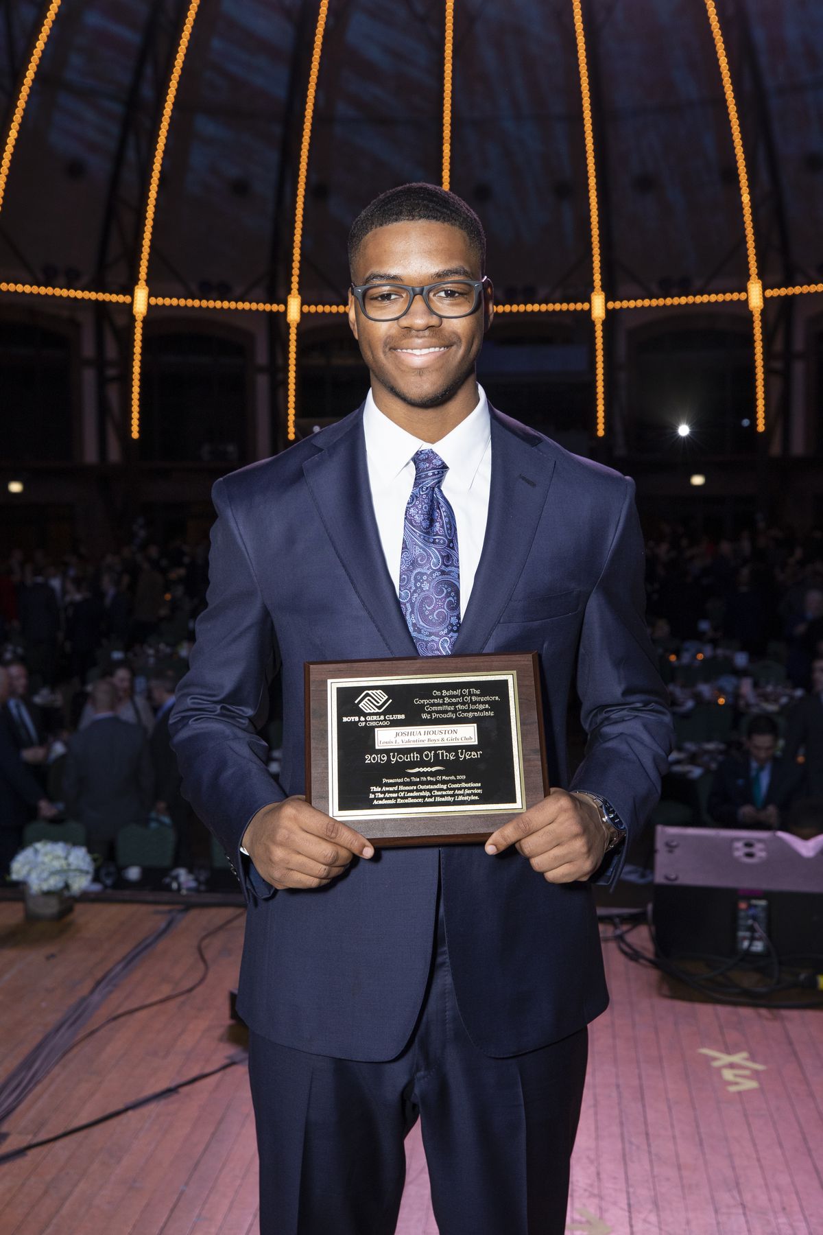 Joshua Houston, 18, of Beverly, shows off his Boys &amp; Girls Clubs of Chicago Youth of the Year Award, the 117-year-old nonprofit’s highest honor, at its March 7 Youth of the Year Gala at Navy Pier. | Provided photo