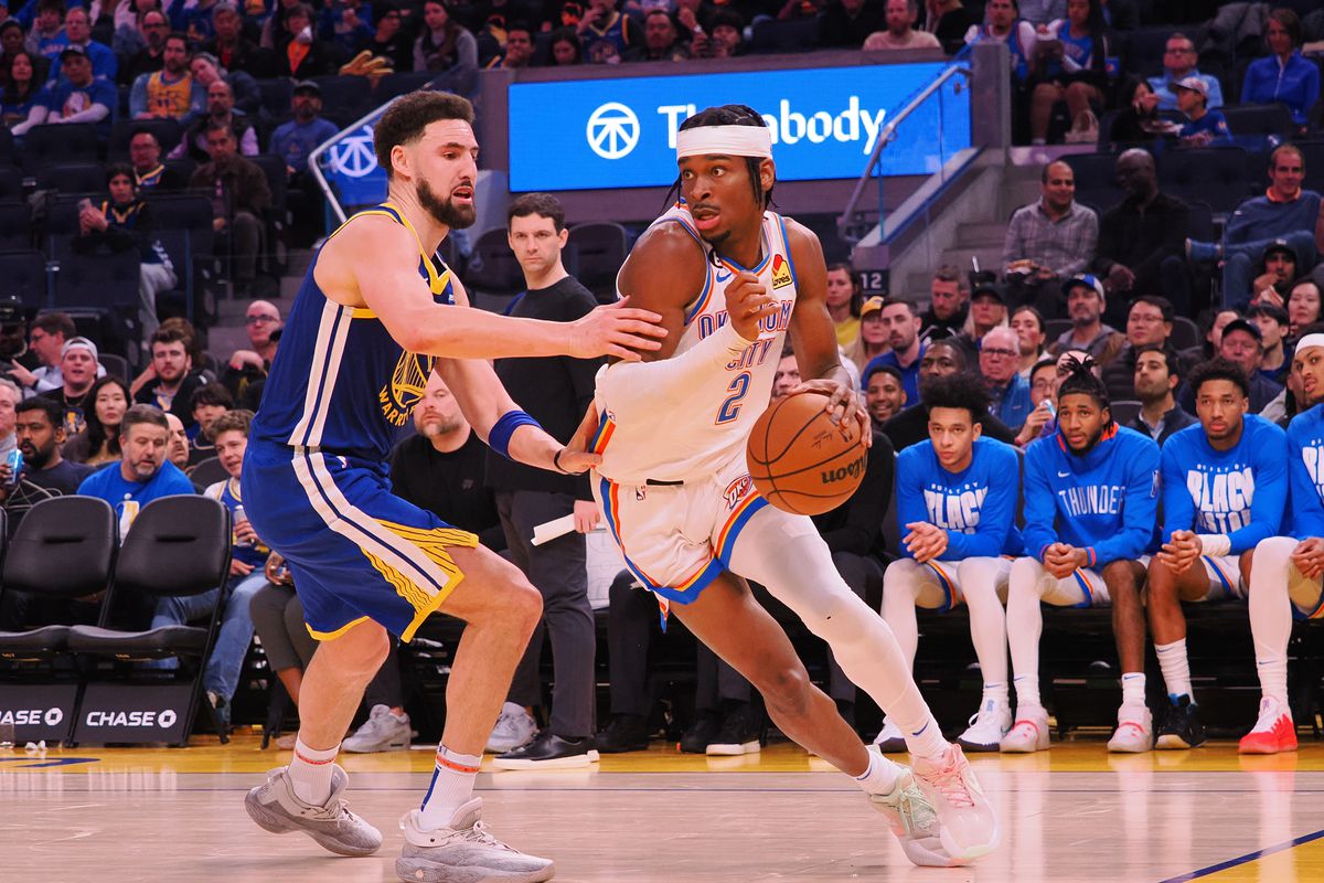 Oklahoma City Thunder shooting guard Shai Gilgeous-Alexander (2) controls the ball against Golden State Warriors shooting guard Klay Thompson (11) during the third quarter at Chase Center