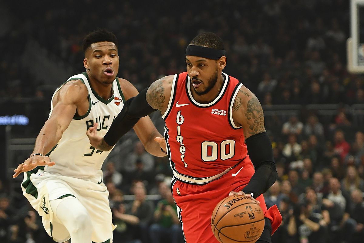 Carmelo Anthony of the Portland Trail Blazers drives around Giannis Antetokounmpo of the Milwaukee Bucks during the first half of a game at Fiserv Forum on November 21, 2019 in Milwaukee, Wisconsin.