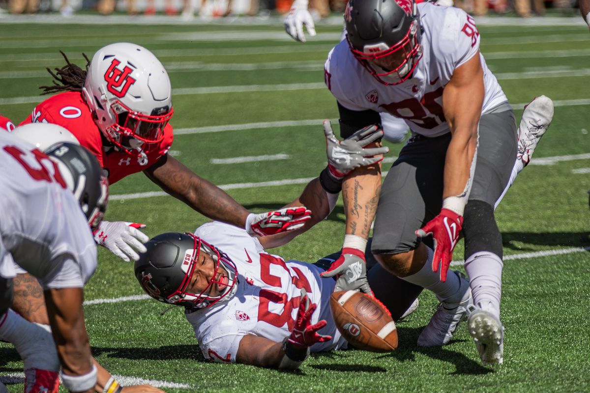 SALT LAKE CITY, UT - SEPTEMBER 25: Washington State EDGEs Travion Brown (82) and Brennan Jackson (80) attempt to recover a fumble during the second half of a PAC 12 conference matchup between the Utah Utes and the Washington State Cougars on September 25, 2021, at Rice-Eccles Stadium in Salt Lake City, UT.