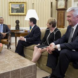 U.S. President Barack Obama meets with faith leaders, including, from second from left, Dr. Russell Moore of the Southern Baptist Convention in Nashville, Tennessee; Suzii Paynter, executive coordinator of Cooperative Baptist Fellowship in Atlanta, Georgia, and Dieter Uchtdorf of The Church of Jesus Christ of Latter-day Saints in Salt Lake City, Utah, on Tuesday, April 15, 2014, in the Oval Office of the White House in Washington.