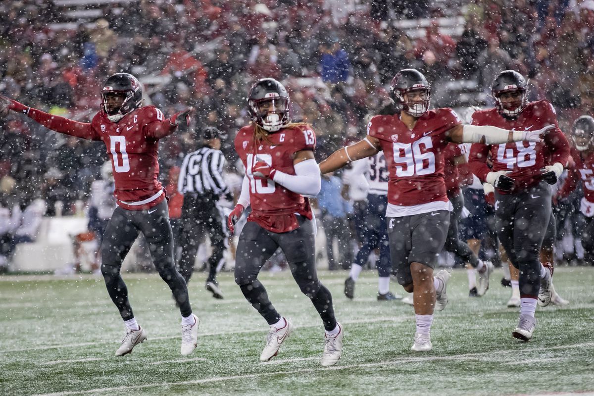 PULLMAN, WA - NOVEMBER 19: Washington State defense celebrates a stop in the first half of a PAC 12 conference matchup between the Arizona Wildcats and the Washington State Cougars on November 19, 2021, at Martin Stadium in Pullman, WA.