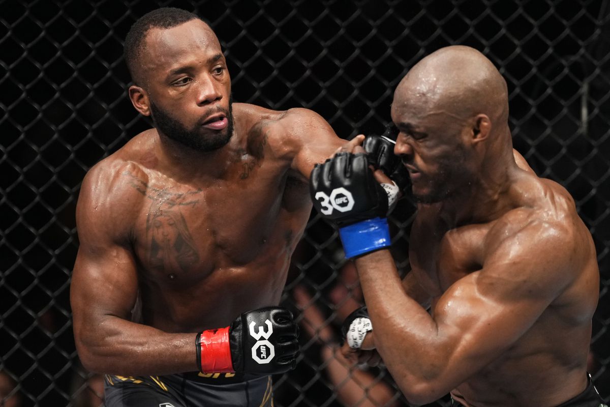 Leon Edwards punches Kamaru Usman at UFC 286 in London, England