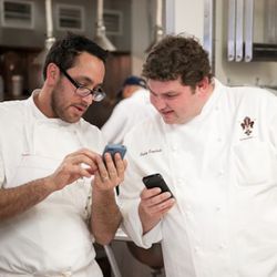 Christopher Kostow shares a moment with night 2 chef Kelly English, comparing notes about Spotify. 