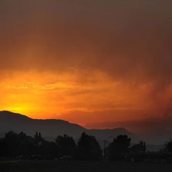 The sun sets as seen from Lower Gold Camp Road as a wildfire continues to burn west of Colorado Springs, Colo. on Sunday, June 24, 2012. 