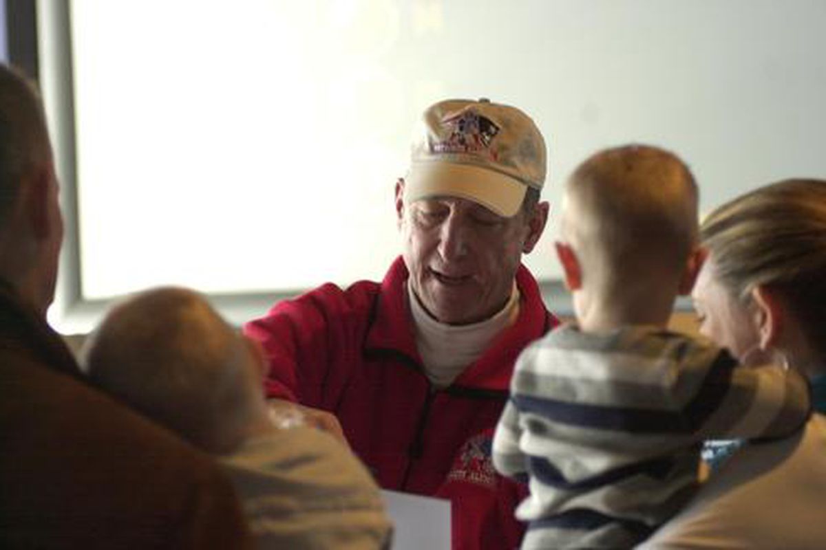 <em>Steve Grogan signs autographs at the second annual Patriot Place Cares about Kids Day at The Hall at Patriot Place. </em>