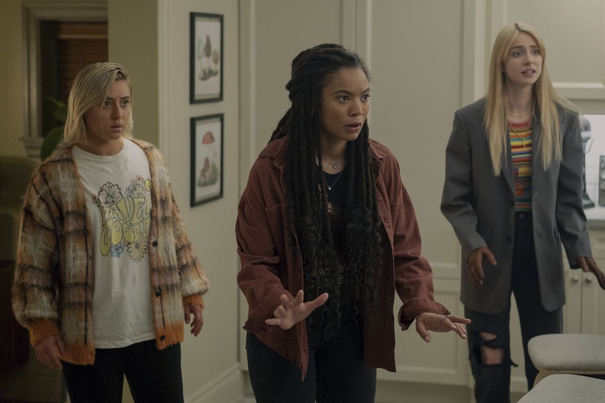 Lizzie Broadway, Jaz Sinclair, and Maddie Phillips stand next to each other in a room in Gen V.