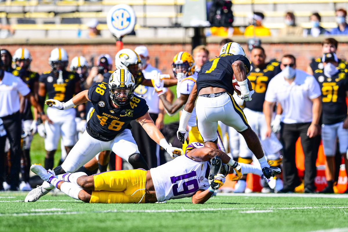 Jabril Cox of the LSU Tigers makes a tackle against the Missouri Tigers on October 10, 2020 at Memorial Stadium in Columbia, Missouri.