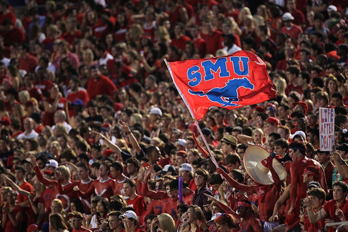 DALLAS - SEPTEMBER 24:  Fans of the SMU Mustangs wave a flag during play against the TCU Horned Frogs at Gerald J. Ford Stadium on September 24 2010 in Dallas Texas.  (Photo by Ronald Martinez/Getty Images)
