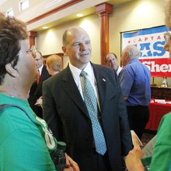 In this photo taken June 21, 2012, Sedgwick County district attorney candidate Kevin O'Connor talks with a couple of supporters before a Republican Candidate Forum in Wichita, Kan.  