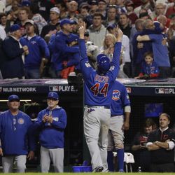 Chicago Cubs' Anthony Rizzo celebrates in the dugout after scoring on a hit by Miguel Montero during the 10th inning of Game 7 of the Major League Baseball World Series against the Cleveland Indians Thursday, Nov. 3, 2016, in Cleveland. 