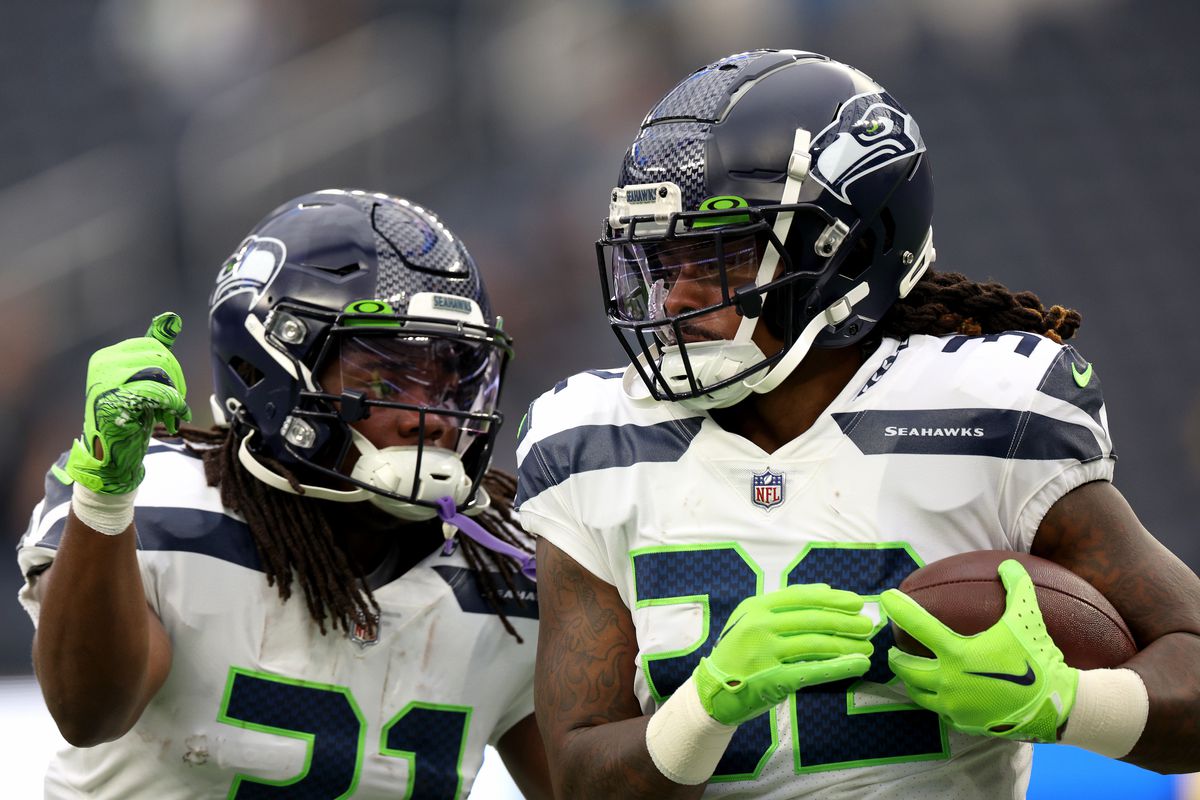 &nbsp;Tony Jones Jr. #32 and DeeJay Dallas #31 of the Seattle Seahawks warm up before the game against the Los Angeles Rams at SoFi Stadium on December 04, 2022 in Inglewood, California.