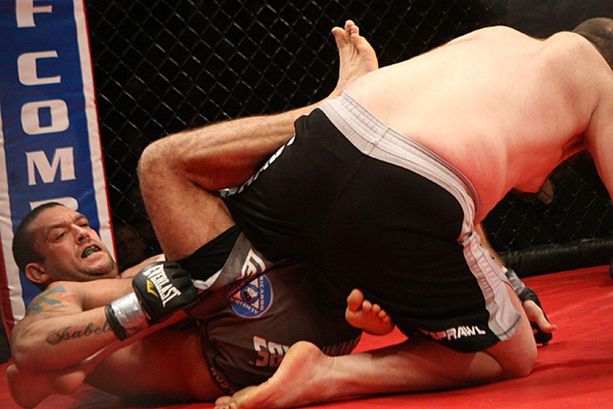 <em>Tom DeBlass snatches a leg</em> - Photo via Sherdog.com