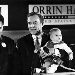 Sen. Orrin Hatch election event with (L to R) former Heavy Weight Champion and close friend Muhammad Ali, Senator Hatch and a grandchild with wife Elaine Hatch, Nov. 9, 1988. 
