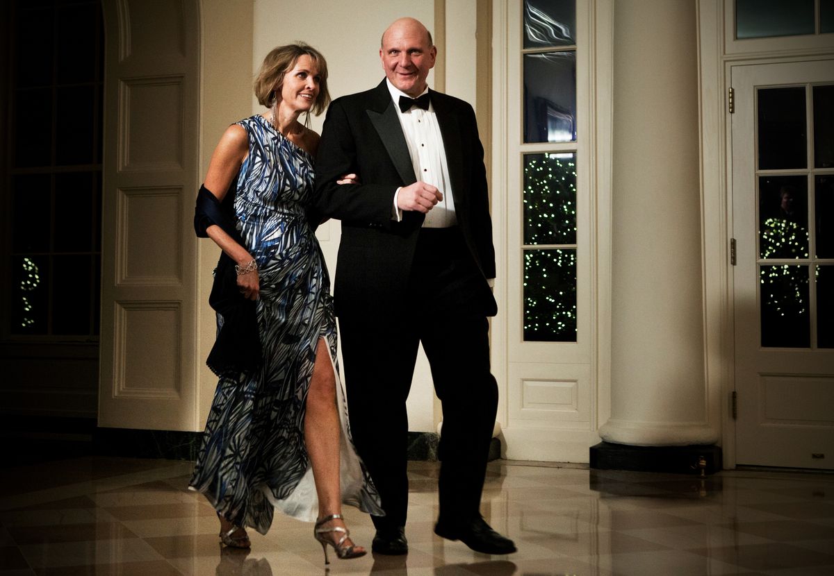 Connie and Steve Ballmer in formal wear walking in the White House.