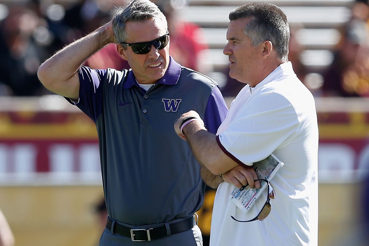 Chris Petersen scratches his head as he contemplates the finer points of the Copper State Curse.