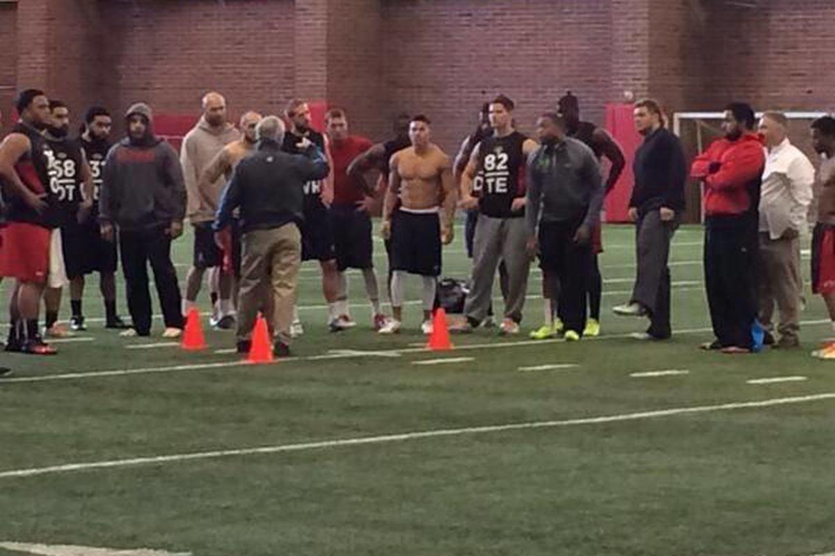 Players listen to instructions before the drills begin at Utah's pro day Wednesday.