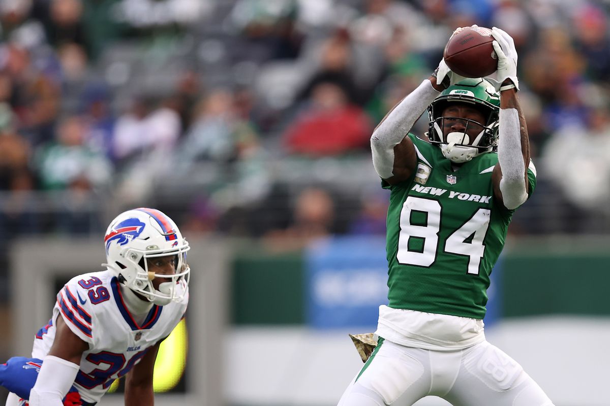 EAST RUTHERFORD, NEW JERSEY - NOVEMBER 14: Corey Davis #84 of the New York Jets makes a catch in the third quarter against the Buffalo Bills at MetLife Stadium on November 14, 2021 in East Rutherford, New Jersey.