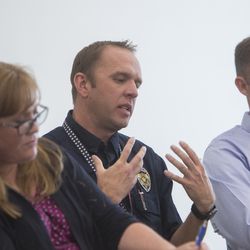Unified police detective Jacob Cutright, center, talks about the opioid epidemic during a roundtable discussion at the Jordan Academy for Technology & Careers South Campus in Riverton on Monday, May 21, 2018.
