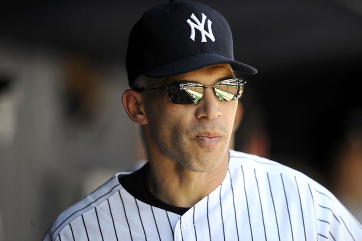NEW YORK - MAY 05:  Joe Girardi #28 of the New York Yankees walks in the dugout against the Baltimore Orioles at Yankee Stadium on May 5, 2010 in the Bronx borough of New York City  (Photo by Jeff Zelevansky/Getty Images)