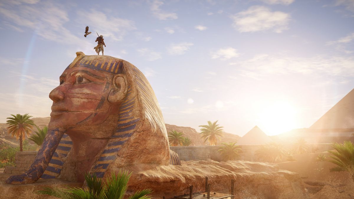 Assassin's Creed Origins - Bayek stands on top of the sphinx