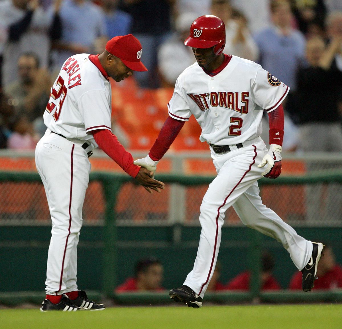Washington Nationals Damian Jackson (2) is congratulated by