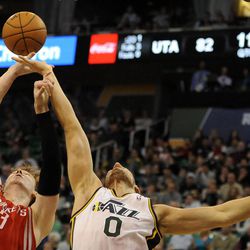 Houston Rockets center Omer Asik (3) and Utah Jazz center Enes Kanter (0) vie for a rebound during a game at EnergySolutions Arena on Monday, Dec. 2, 2013.