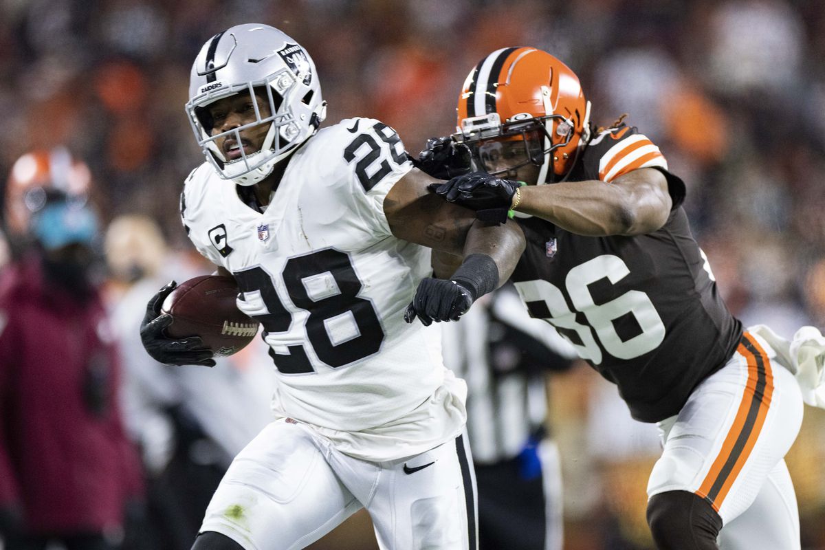 Cleveland Browns cornerback M.J. Stewart (36) pushes Las Vegas Raiders running back Josh Jacobs (28) out of bounds during the first quarter at FirstEnergy Stadium.