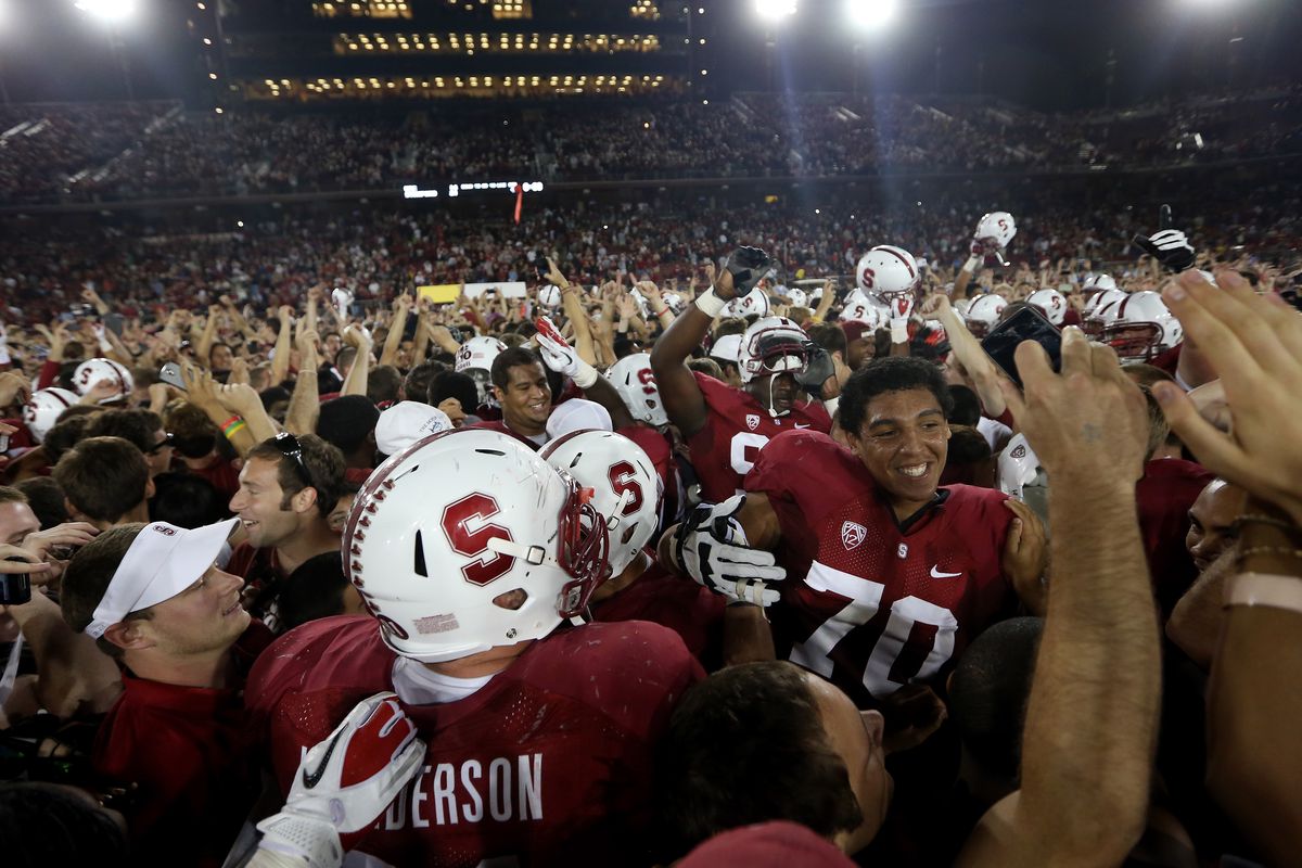 PALO ALTO, CA - SEPTEMBER 15:  Fans celebrate on the field with the players after the Stanford Cardinal beat the USC Trojans at Stanford Stadium on September 15, 2012 in Palo Alto, California.  (Photo by Ezra Shaw/Getty Images)