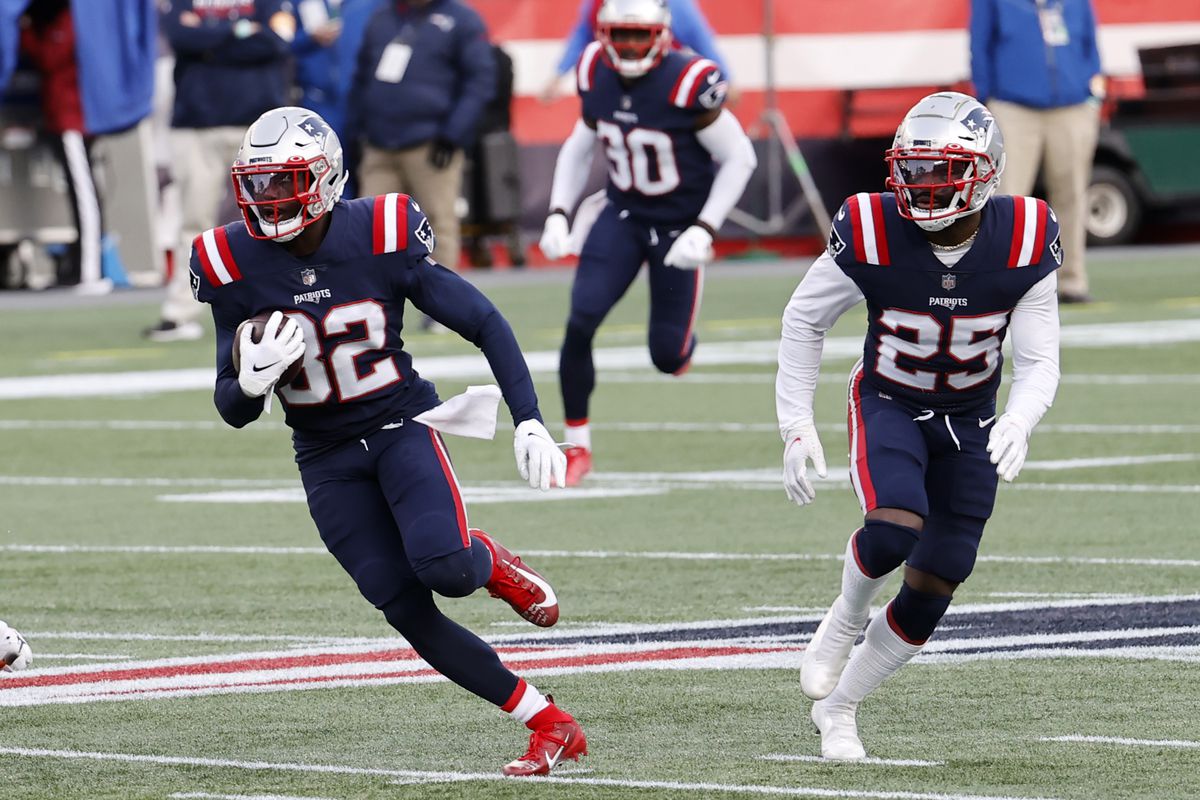 New England Patriots defensive back Devin McCourty (32) returns an interception during a game between the New England Patriots and the San Francisco 49ers on October 25, 2020, at Gillette Stadium in Foxborough, Massachusetts.