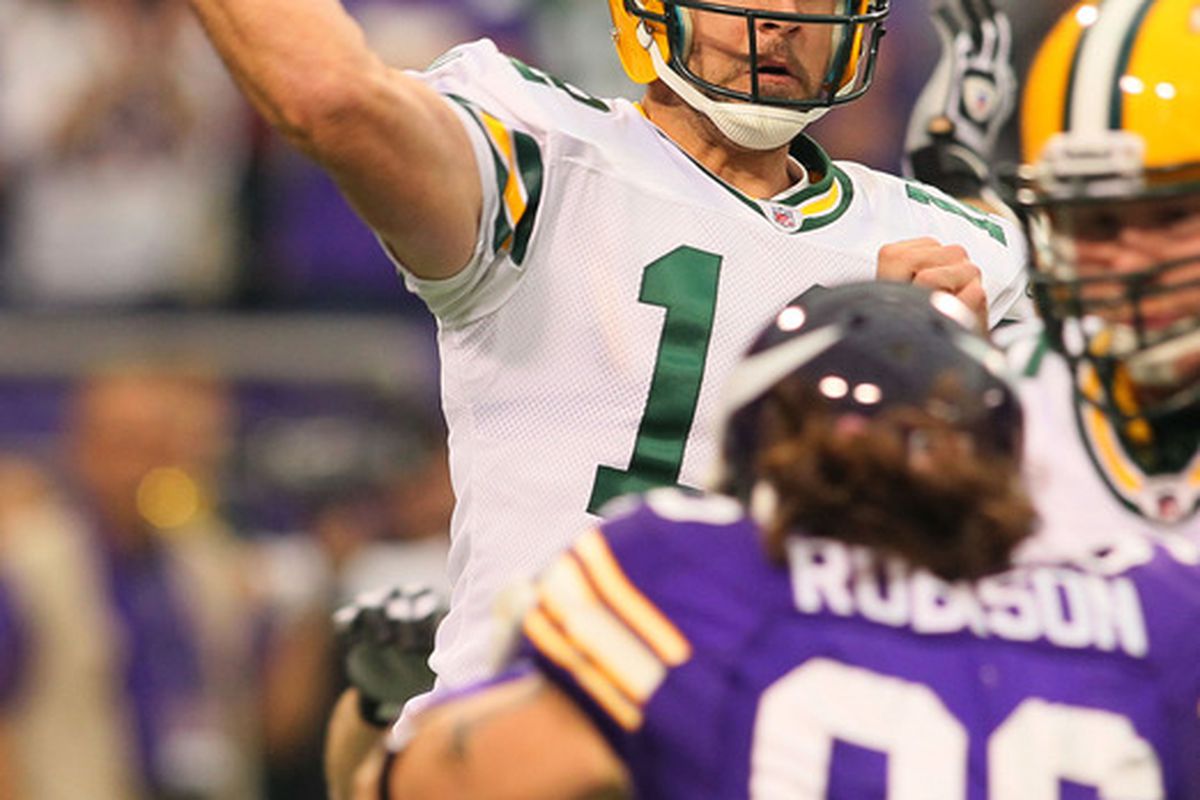 MINNEAPOLIS, MN - OCTOBER 23:  Aaron Rodgers #12 of the Green Bay Packers attempts the pass against the Minnesota Vikings at the Hubert H. Humphrey Metrodome on October 23, 2011 in Minneapolis, Minnesota.  (Photo by Adam Bettcher /Getty Images)