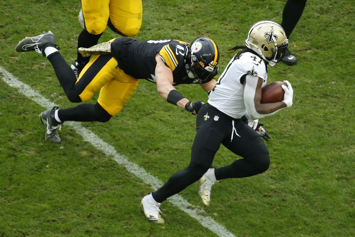 Alvin Kamara #41 of the New Orleans Saints avoids a tackle from Robert Spillane #41 of the Pittsburgh Steelers during the second half at Acrisure Stadium on November 13, 2022 in Pittsburgh, Pennsylvania.