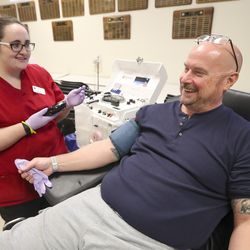 Madison Esmay, American Red Cross collection specialist, talks with Jim Vesock as she prepares to draw his blood during a blood drive at the Salt Lake County Jail in South Salt Lake on Monday, Sept. 30, 2019. The Salt Lake County Sheriff’s Office and the Unified Police Department teamed with the American Red Cross for the event.
