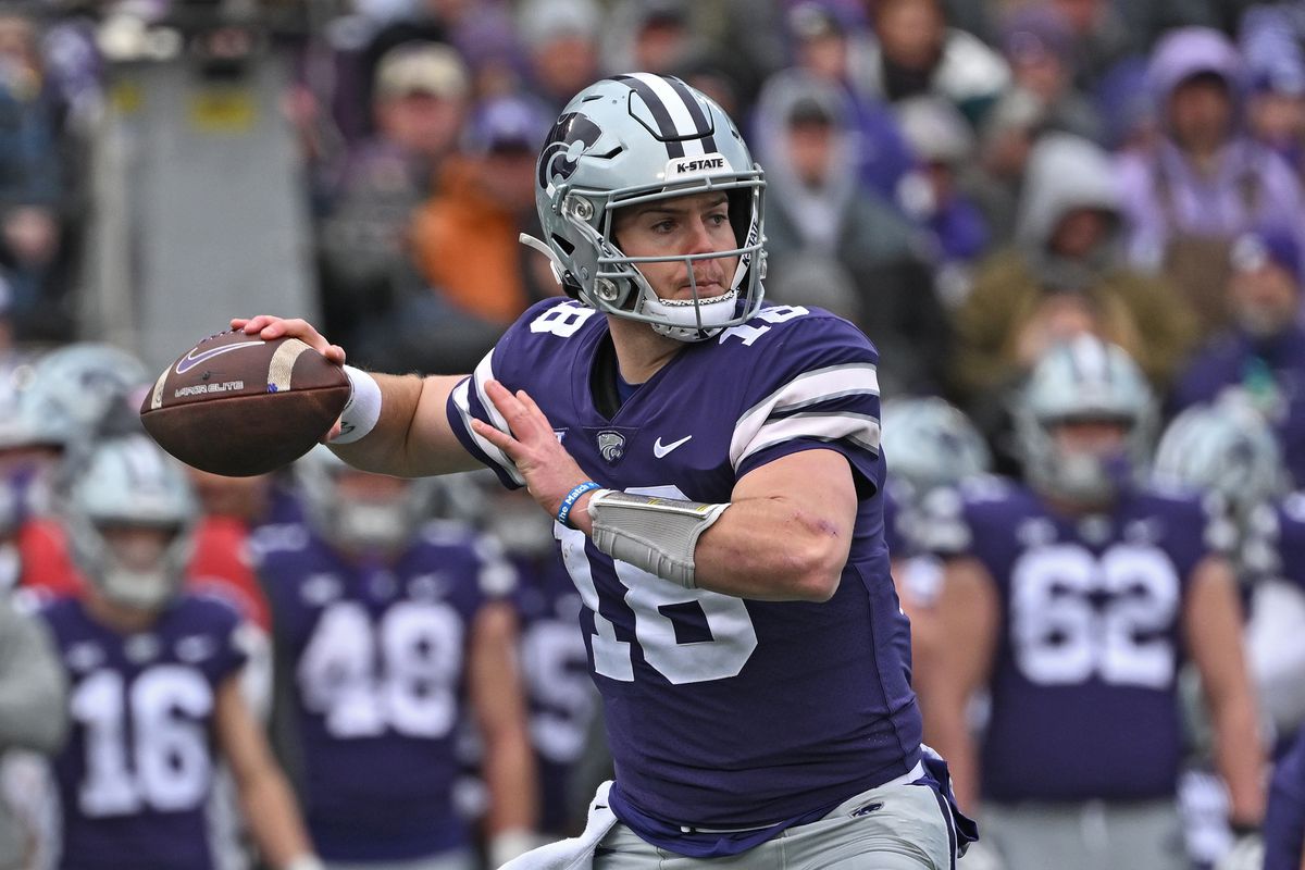 MANHATTAN, KS - OCTOBER 28: Quarterback Will Howard #18 of the Kansas State Wildcats throws a pass against the Houston Cougars during the first half at Bill Snyder Family Football Stadium on October 28, 2023 in Manhattan, Kansas.