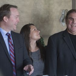 Salt Lake County Mayor Ben McAdams, Destiny Garcia, an Operation Rio Grande client and sober living resident, and Mike Brown, executive director of Next Level Recovery and sober living homeowner, laugh during a press conference about a new sober living housing program at the sober living home in Murray on Monday, Jan. 29, 2018. The new program puts people in affordable and safe housing as they continue to be treated for substance use.