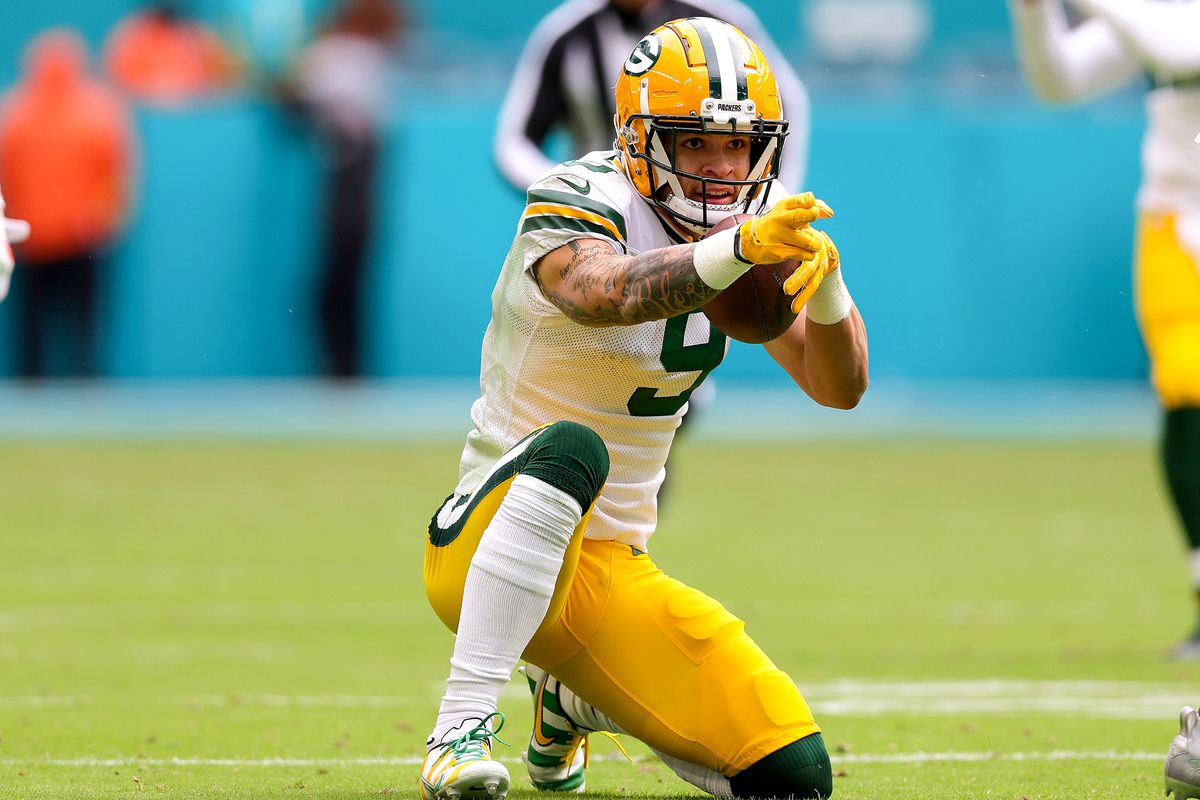 Christian Watson of the Green Bay Packers reacts after a first down reception against the Miami Dolphins during the second quarter of the game at Hard Rock Stadium on December 25, 2022 in Miami Gardens, Florida.