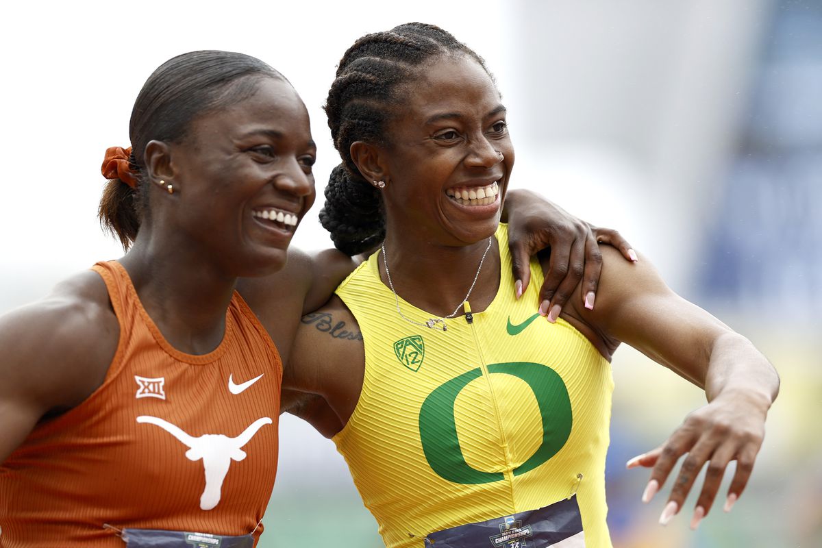 Julien Alfred of Texas reacts with Kemba Nelson of Oregon after placing first and second, respectively, in the 100 meter dash during the NCAA Track &amp; Field Championships at Hayward Field on June 11, 2022 in Eugene, Oregon.