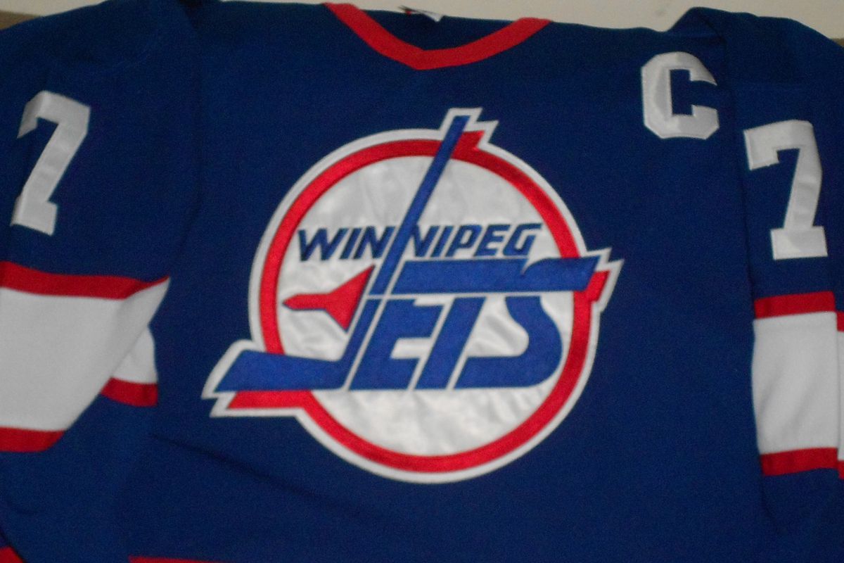 old-style Winnipeg Jets jersey circa 1994 signed by Keith Tkachuk