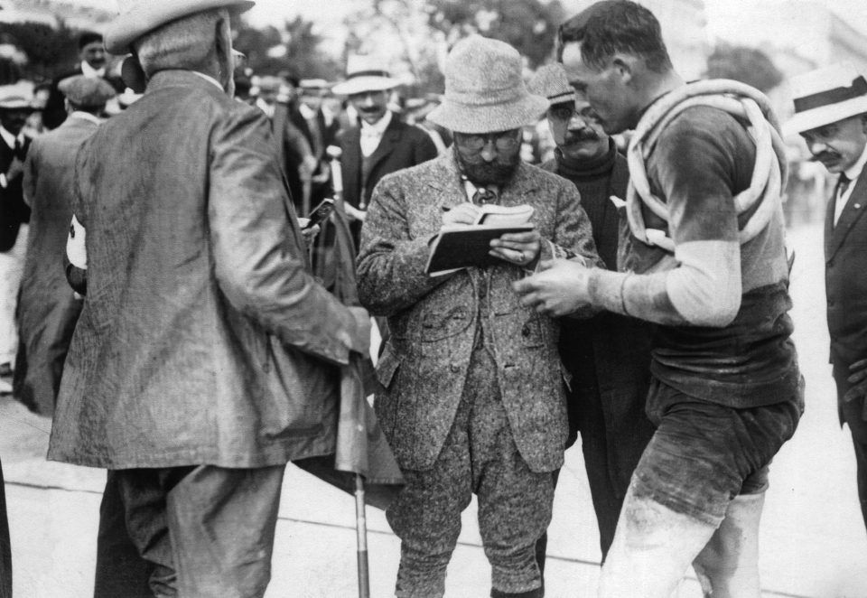 Georges Abran (with his back to the camera), Alphonse Steinès and François Faber at the 1911 Tour de France.