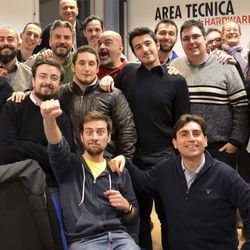 This December 2016 photo provided Friday, Aug. 18, 2017 by Tom's Hardware Italy shows Bruno Gulotta, at center wearing a black shirt, with his colleagues at their office in Legnano, near Milan, Italy. Gulotta is one of the 14 victims of Thursday's deadly van attack in Barcelona. (Tom's Hardware Italy via AP)